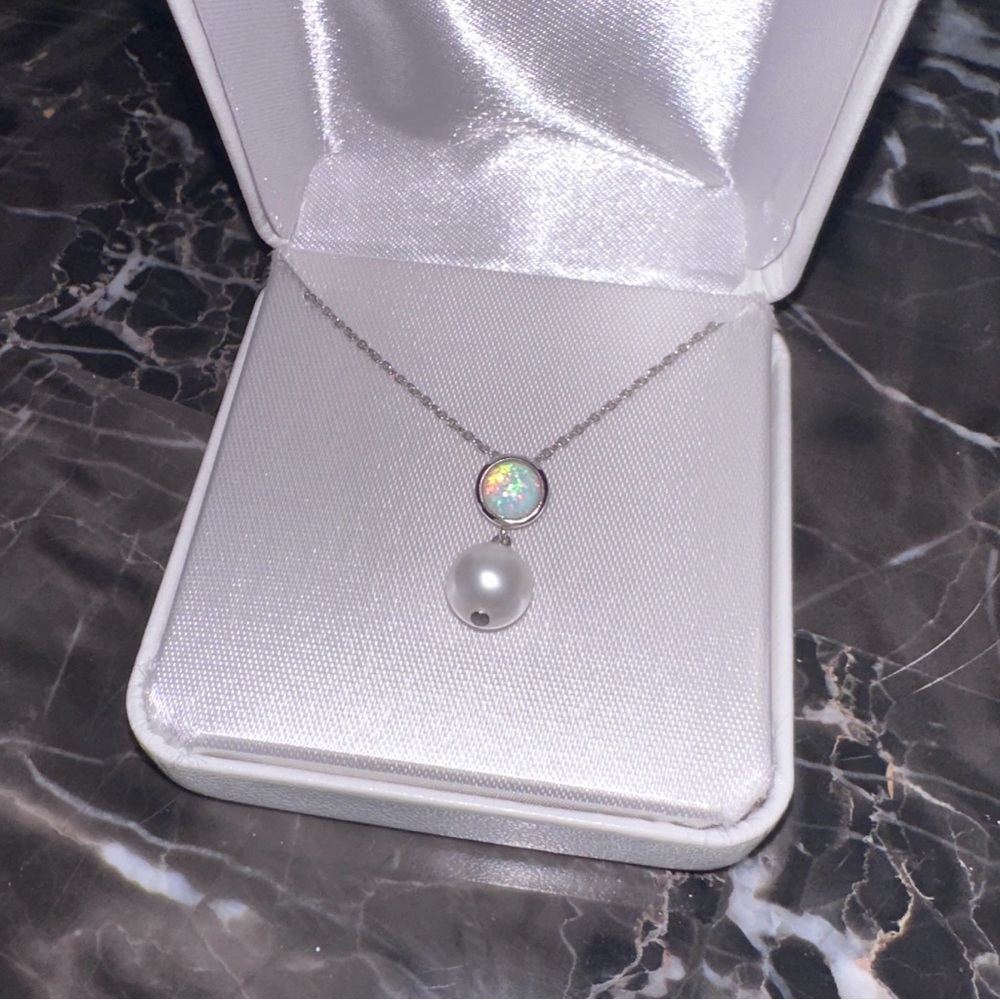Silver chain 18” with pearl and opal pendant. Very dainty and beautiful.